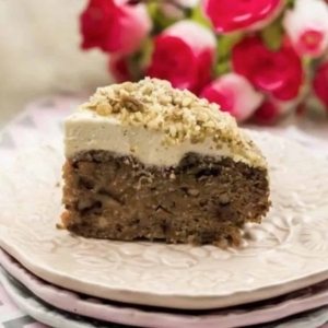 a small piece of carrot cake on a large plate