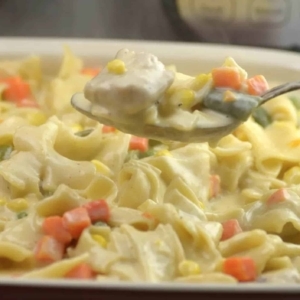 close up of a spoonful of chicken potpie casserole