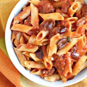 overhead shot of puttanesca vegan pasta