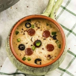 warm pizza soup in a small bowl