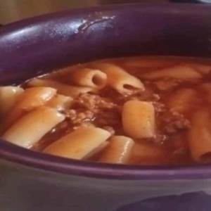 close up of pasta with meat sauce in a bowl