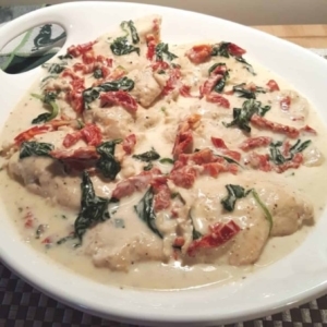 a dish with creamy tuscan garlic chicken