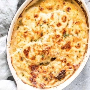 overhead view of scalloped potatoes in a baking dish