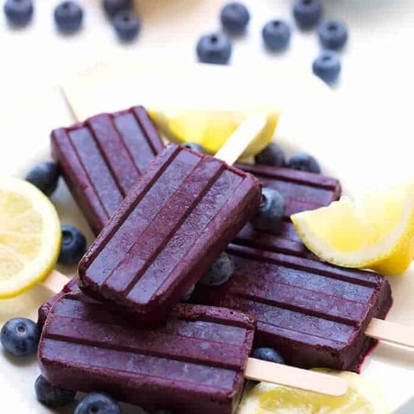 a pile of homemade blueberry lemon popsicles