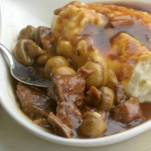 a small bowl of beef tips and gravy