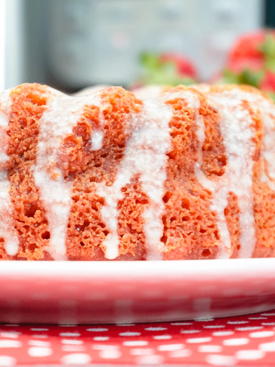 a fresh out of the instant pot strawberries and cream cake on a plate