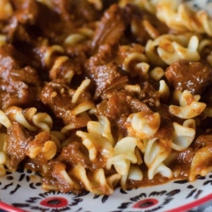 a close up view of hungarian goulash served on a plate