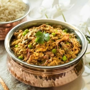 indian kheema in small bowl near a small bowl of rice