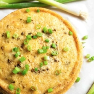 overhead shot of corn pudding garnished scallions