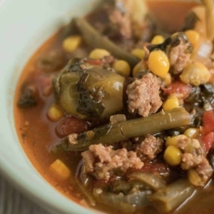 a bowl of vegetable soup up close