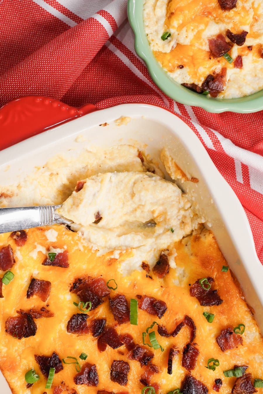 overhead shot of baked cauliflower casserole lightly garnished with scallions