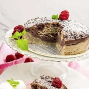 a plate with a partially eaten raspberry swirl cake