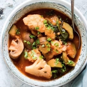 top view of vegetable soup garnished with cilantro