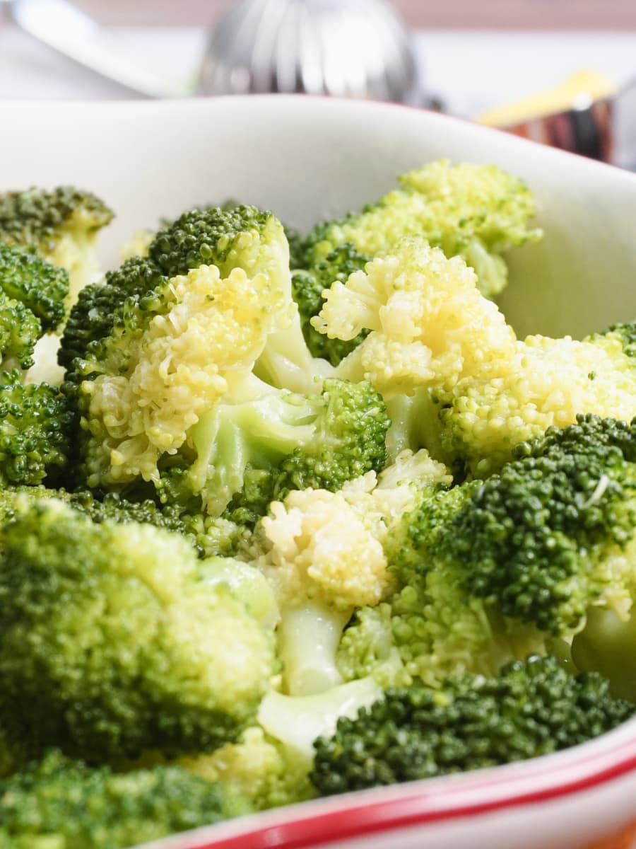 a bowl filled with lemon butter garlic broccoli