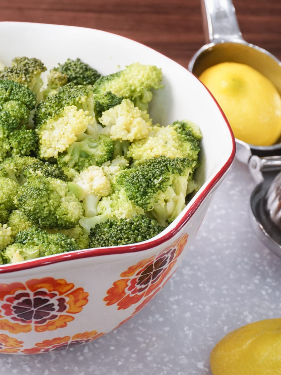 a bowl filled with lemon butter garlic broccoli