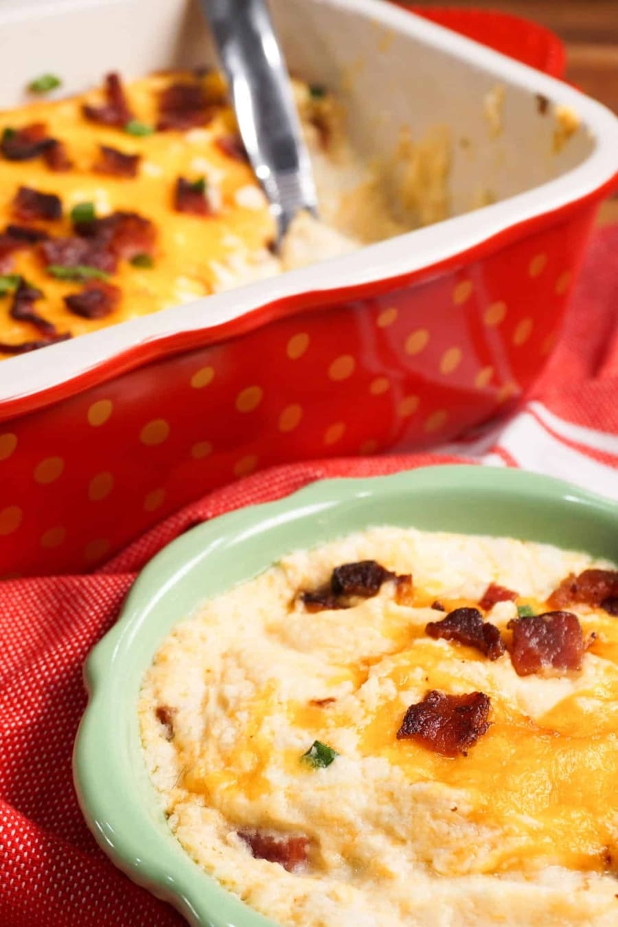 close up of loaded cauliflower casserole with bacon bits on a plate