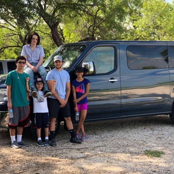 the family posing near the van