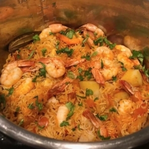 an instant pot filled with shrimp biryani