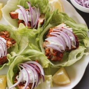 overhead shot of a group of tandoori chicken lettuce wraps