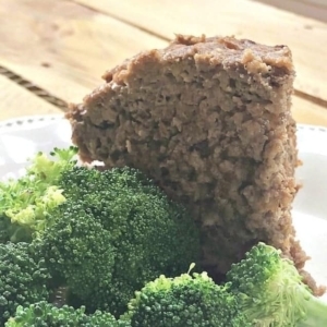 applesauce meatloaf on a plate with broccoli