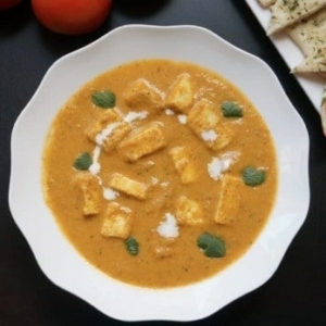 top view of a bowl of paneer butter masala