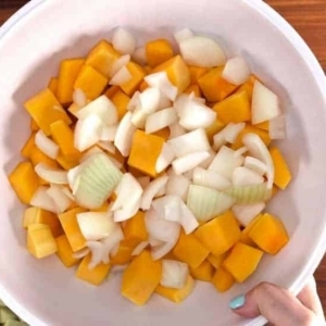 onions and butternut squash chopped up in a bowl