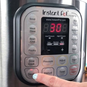 setting the Instant Pot to saute to cook ground beef for cheeseburger casserole