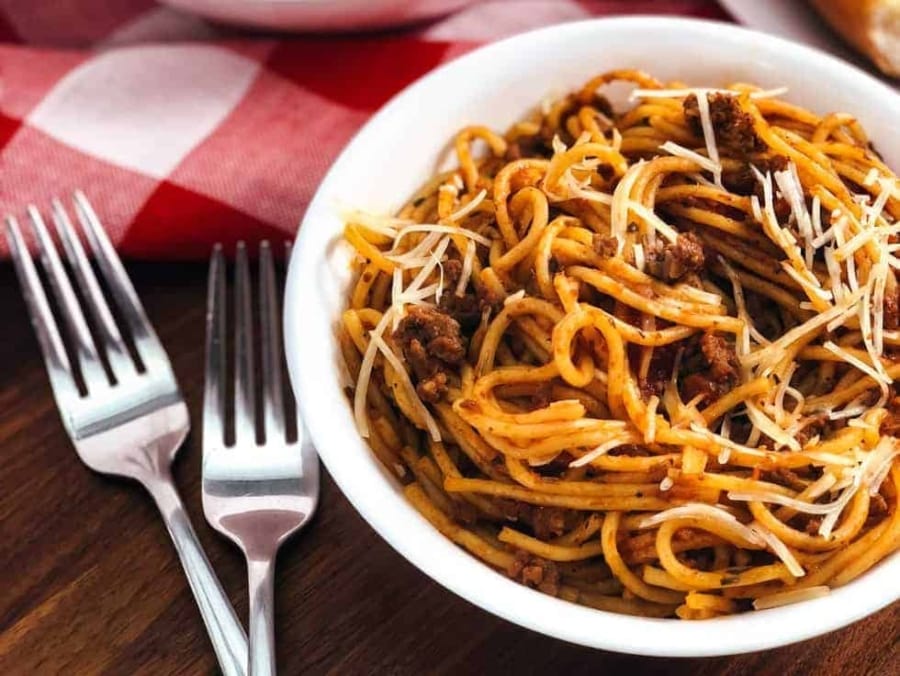 spaghetti and meat sauce served in a bowl