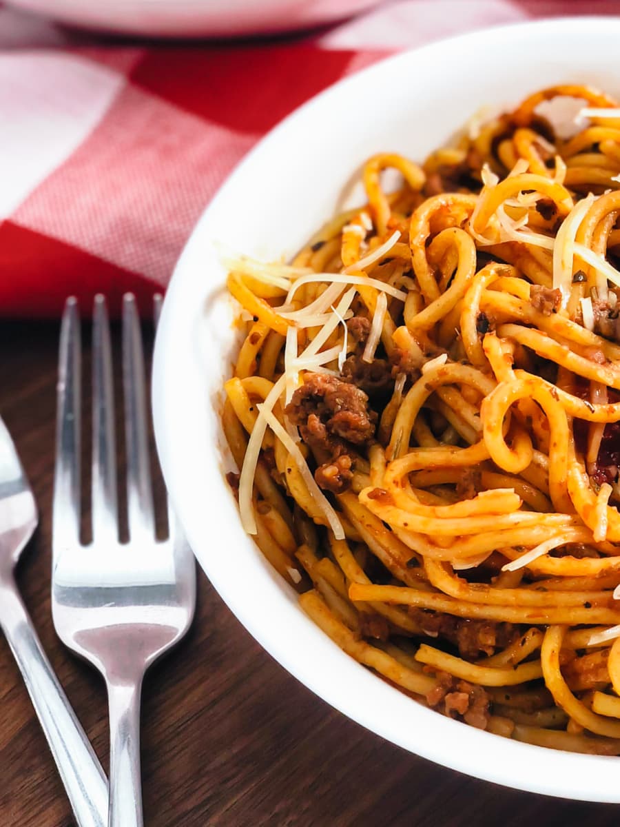 spaghetti and meat sauce served in a bowl