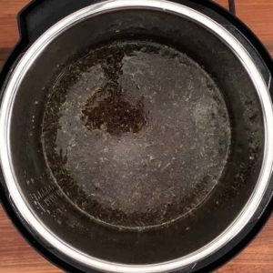 seasoned ground beef and beef broth in the instant pot