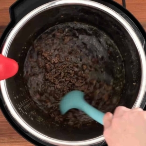 mixing beef broth into ground beef in the instant pot