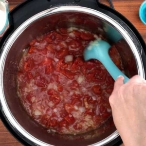 mixing the tomato soup