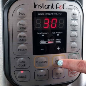 adjusting the saute heat on the instant pot to melt butter for tomato soup