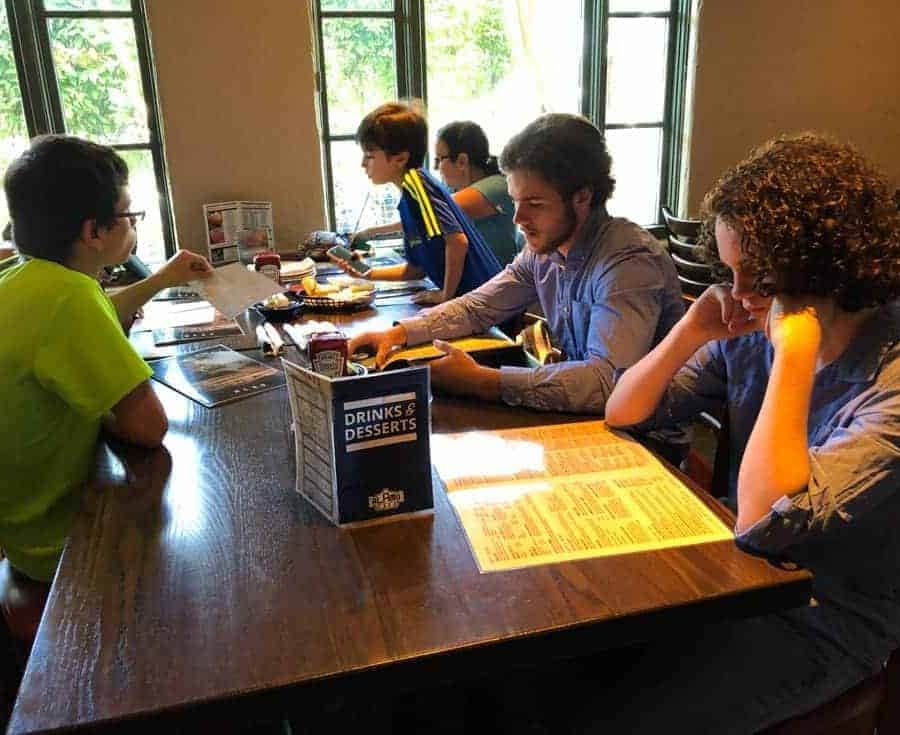 the kids at the table ready to order at alamo cafe san antonio