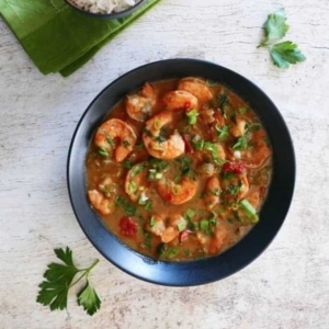 overhead shot of new orleans style shrimp etouffe garnished with cilantro