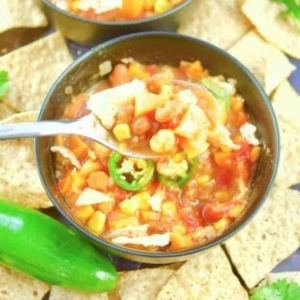 a spoonful of sweet potato chili from a small bowl