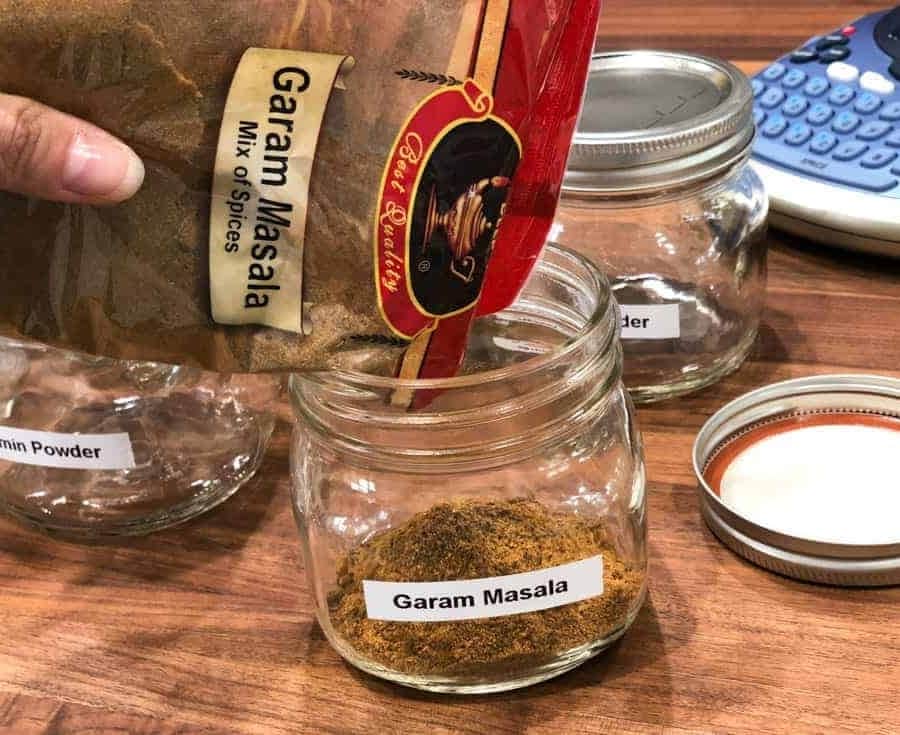 filling labeled spice jars