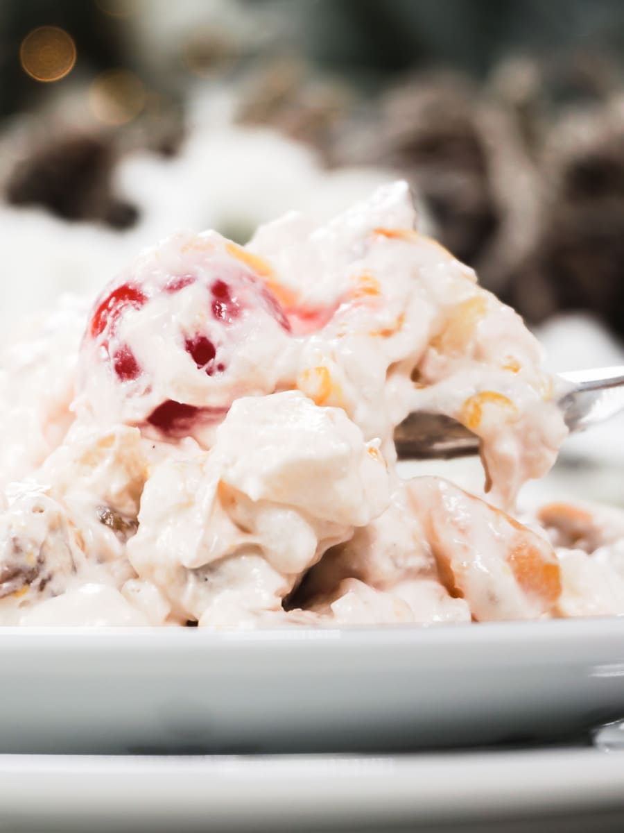 side view of ambrosia fruit salad on a plate