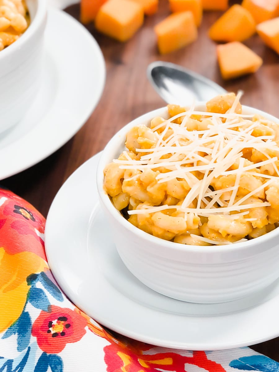 a bowl of butternut mac and cheese with parmesan cheese