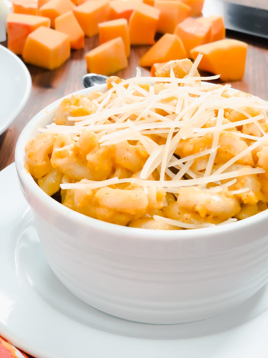 two bowls of butternut mac and cheese with parmesan cheese