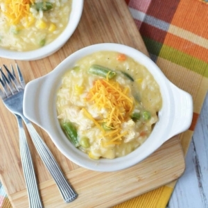 overhead shot of chicken and rice with shredded cheddar