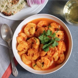 overhead shot of shrimp curry garnished with cilantro