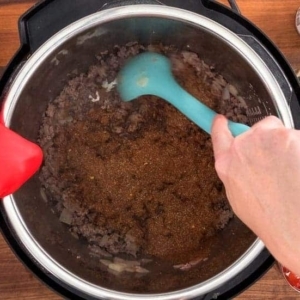 seasoning instant pot taco soup with a blend of taco spices