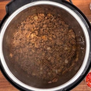 seasoning instant pot taco soup with a blend of mexican spices