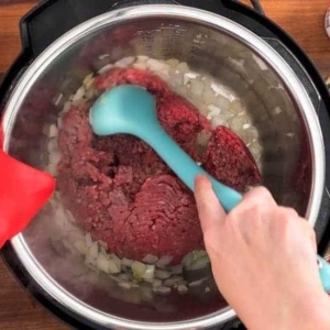 adding ground beef to the instant pot