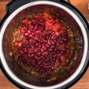 red kidney beans being added to instant pot taco soup