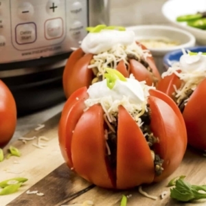 a few tomato tacos on a counter