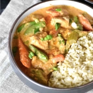 overhead shot of a bowl of thai red curry salmon