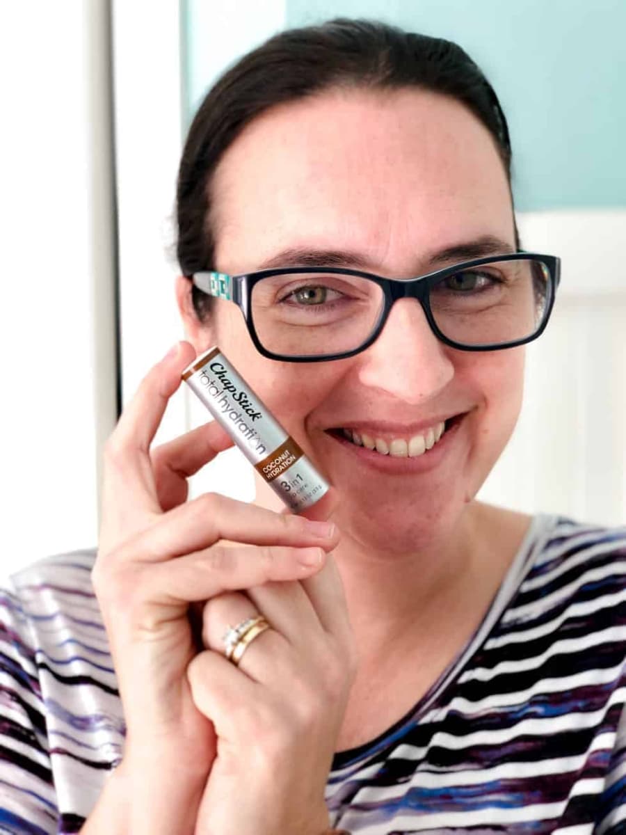 Valerie holding a ChapStick Total Hydration in Coconut