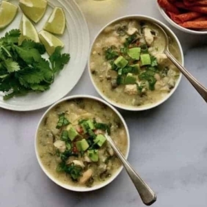 overhead shot of two bowls of white chicken poblano chili